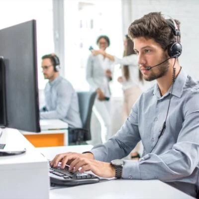 Young,Handsome,Male,Customer,Support,Phone,Operator,With,Headset,Working